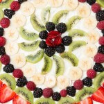 Fruit pizza with a soft sugar cookie crust ohsweetbasil.com