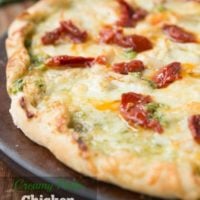 Creamy Pesto Chicken and Sun Dried Tomatoes has this really chewy and delicious thin crust and is definitely one of my favorites! ohsweetbasil.com
