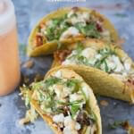 Vegetarian tacos with spicy crema. Fresh veggies sauteed and stuffed into a crunchy delicious taco topped with creamy queso fresco ohsweetbasil.com