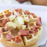 Fluffy waffles filled with sweet apples and crisp bacon are already delicious, but top it with the best apple cider syrup and we are hooked! ohsweetbasil.com-3