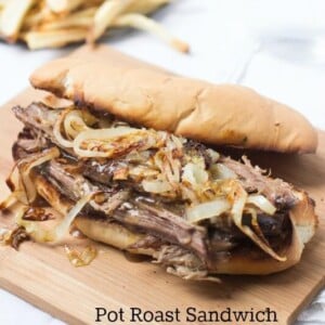Delicious Pot Roast sandwich on a wooden board.