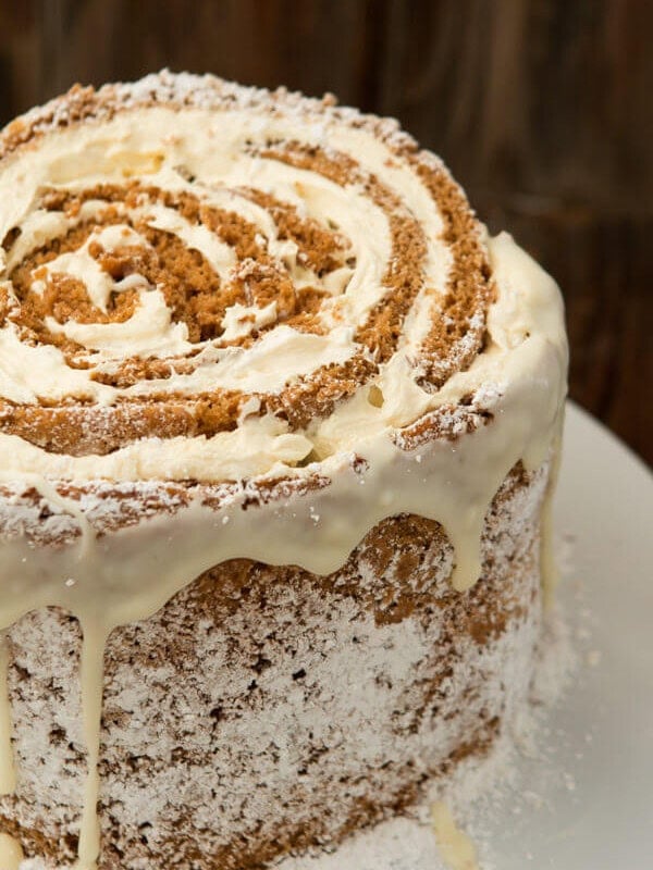 Dessert for a holiday party? No problem. Try this easy pumpkin roll white chocolate cake recipe! ohsweetbasil.com