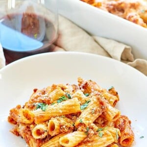 This Spicy Sausage Rigatoni is a simple, hearty, cozy fall dinner! It’s made with rigatoni, a homemade spicy sausage marinara, and smothered in mozzarella! ohsweetbasil.com #pasta #sausage