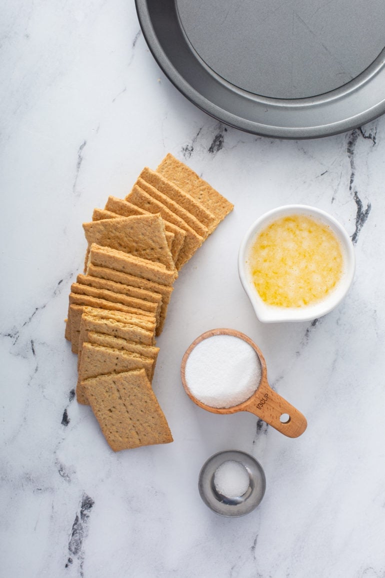 Graham crackers and containers of sugar, and melted butter.