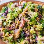Everyone's favorite quick and easy broccoli salad recipe that's perfect for potlucks and BBQs. Plus, it has bacon in it!! ohsweetbasil.com