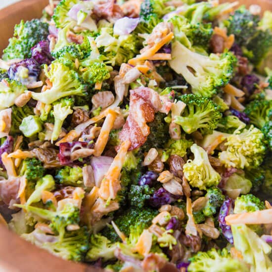 Our very best recipe for broccoli salad loaded with cheese, bacon and a simple dressing ohsweetbasil.com