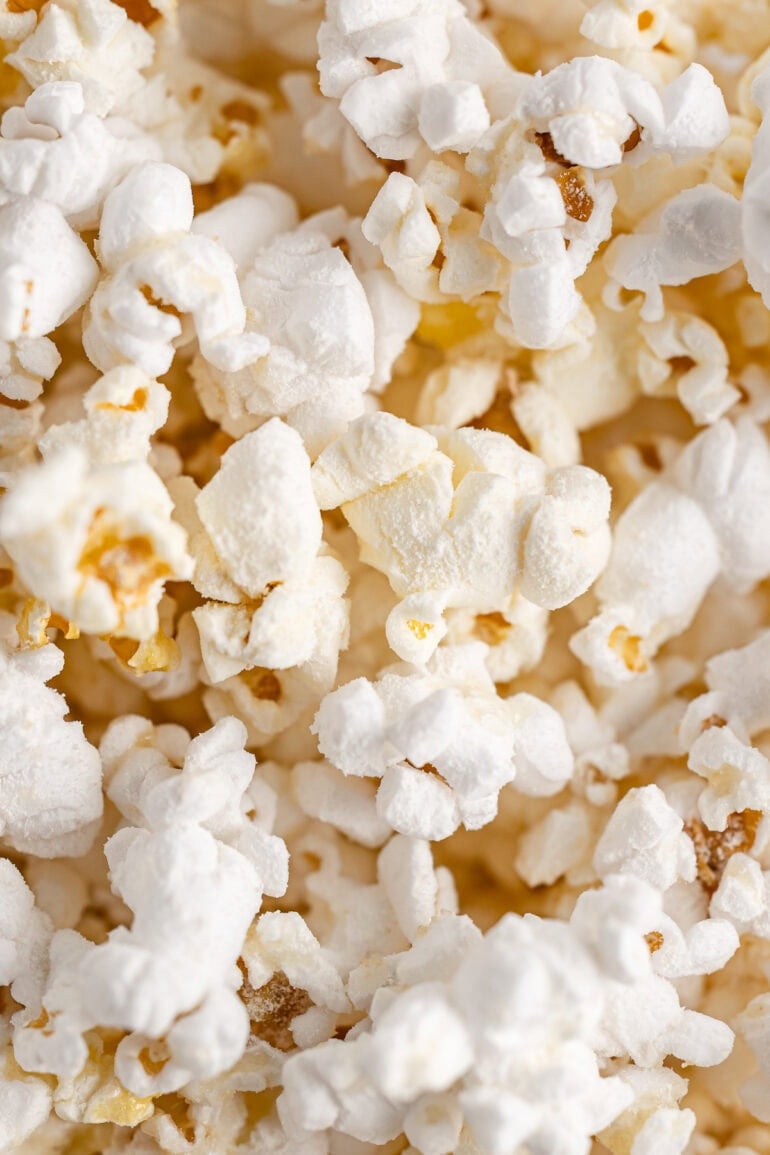closeup of popped popcorn coated in caramel popcorn seasoning