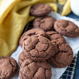 Chocolate snickerdoodle cookies on a metal grate