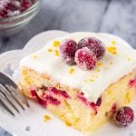 This cranberry orange cake with cream cheese frosting is bursting with holiday flavors. Perfectly moist with the softest cake crumb - the combination of sweet oranges and tart canberries makes it perfect for Christmas.
