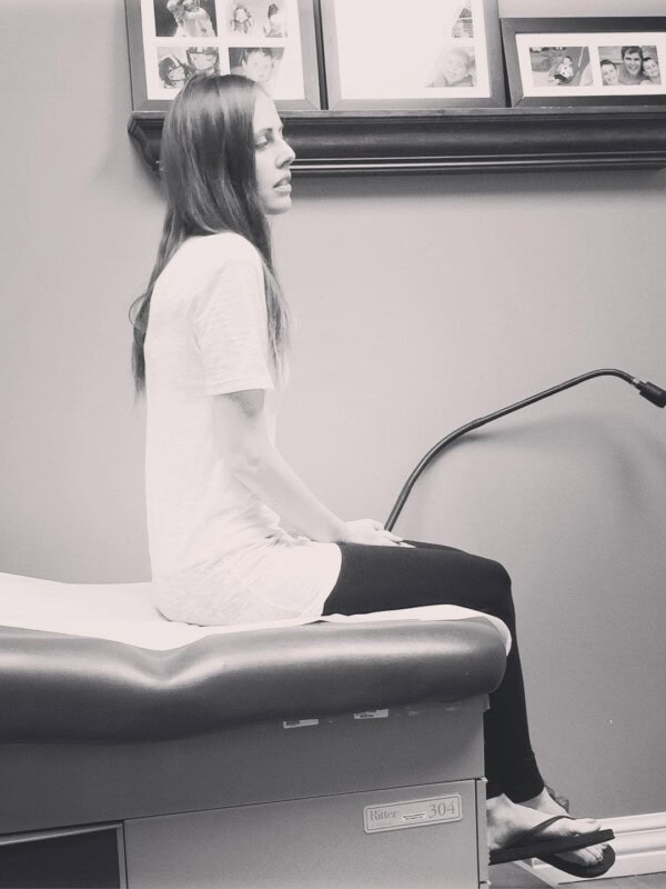 A photo of me sitting at the doctor's office.