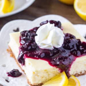 These lemon blueberry cheesecake bars are smooth & creamy with a delicious lemon flavor and crunchy graham cracker crust. Then the blueberry sauce makes them extra special!