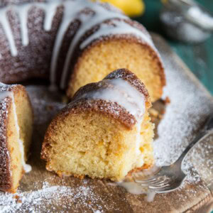 A slice of lemon bundt cake with glaze
