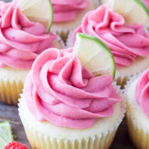 These Raspberry Lime Cupcakes are so pretty and have such a fun flavor combo. They start with moist vanilla cupcakes with a fresh hint of lime, then they're frosted with raspberry buttercream made from fresh berries.