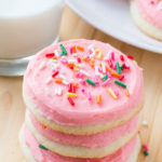 Make Lofthouse sugar cookies at home! These sugar cookies have a delicious buttery vanilla flavor, delicate crumb, and melt in your mouth. Then they're topped with creamy frosting & tons of sprinkles.