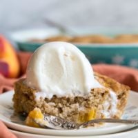 Peach dump cake with ice cream on top