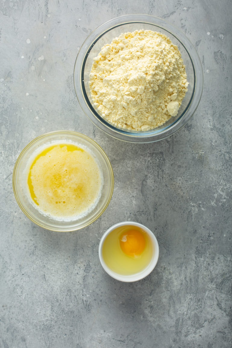 Yellow cake mix, melted butter and egg for making pumpkin gooey butter cake crust