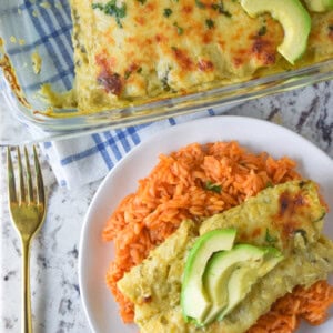 Cheesy chicken enchiladas baked with a homemade roasted tomatillo sauce.