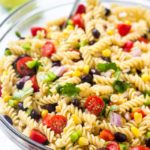 A bowl of southwest pasta salad with corn, tomatoes, black beans & cilantro