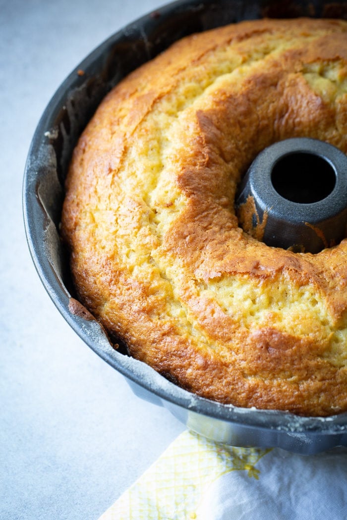 A yellow banana bundt cake in a bundt pan