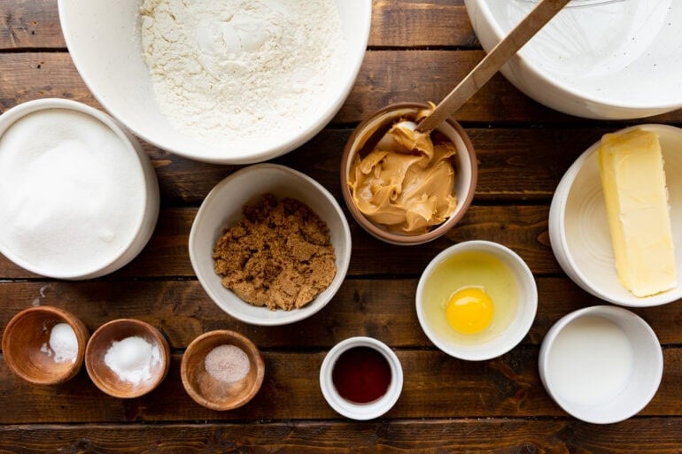 Photo of all ingredients for peanut butter cookies in individual bowls
