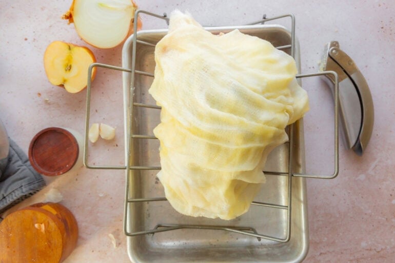 a whole turkey wrapped in a buttery cheesecloth