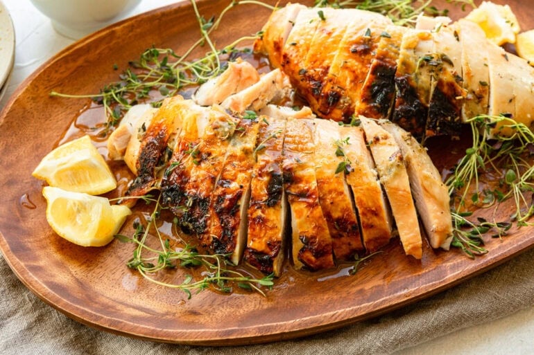 a golden roasted turkey breast that has been sliced
