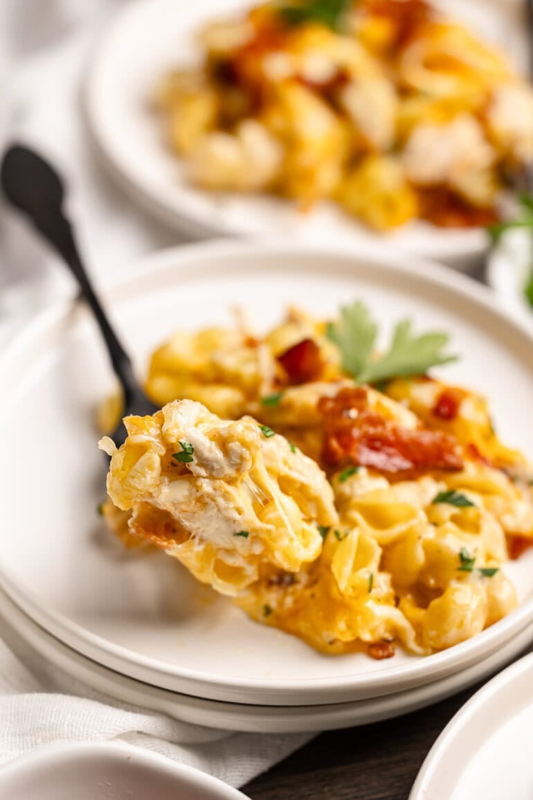 a serving of creamy chicken bacon ranch casserole on a white plate