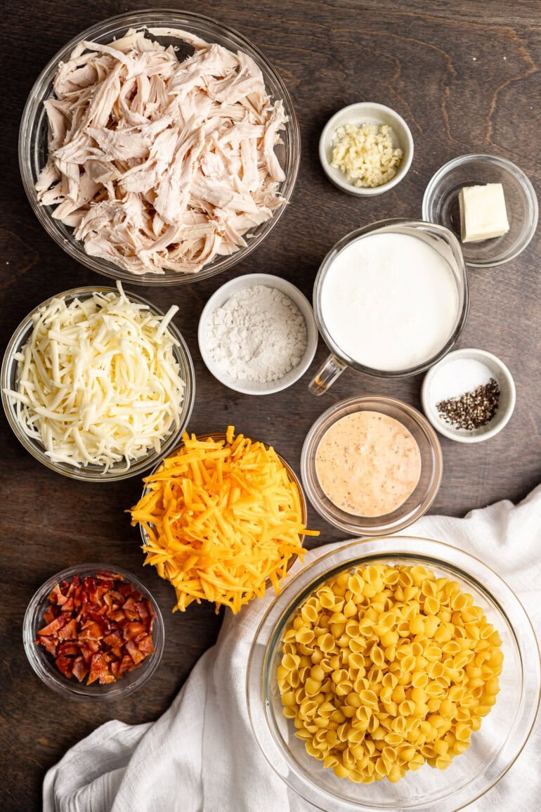 all the ingredients for cheesy bacon ranch casserole in separate small bowl sitting on a table