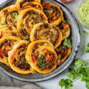 Looking for a quick and easy appetizer for football? Taco pinwheels- touchdown! ohsweetbasil.com