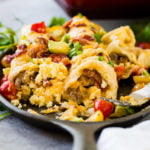 Cheesy egg and sausage breakfast enchiladas casserole to feed a crowd ohsweetbasil.com