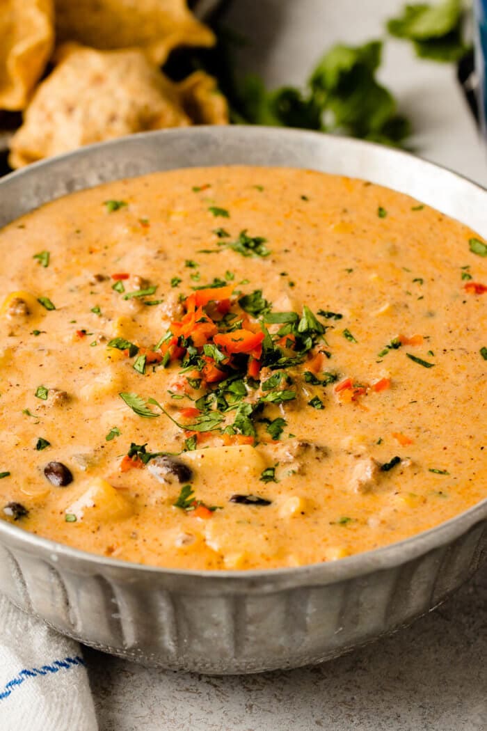 Award winning cheesy ground beef enchilada chili recipe with the easiest list of ingredients ohsweetbasil.com