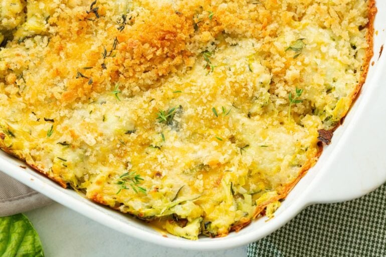 Close-up of cheesy zucchini casserole with crisp golden breadcrumbs