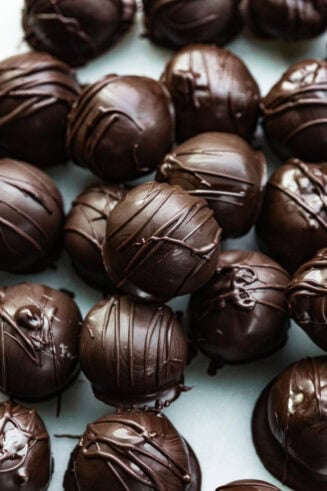 a photo of several peanut butter truffles dipped in dark chocolate