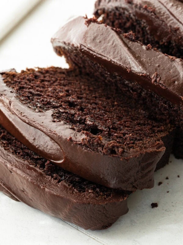 a loaf of moist chocolate pumpkin bread topped with thick chocolate ganache