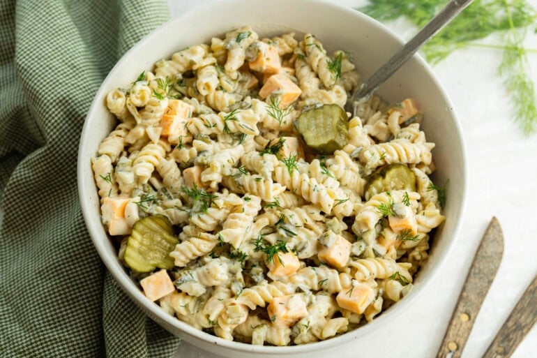 A creamy cold noodle dish with pickled cucumbers