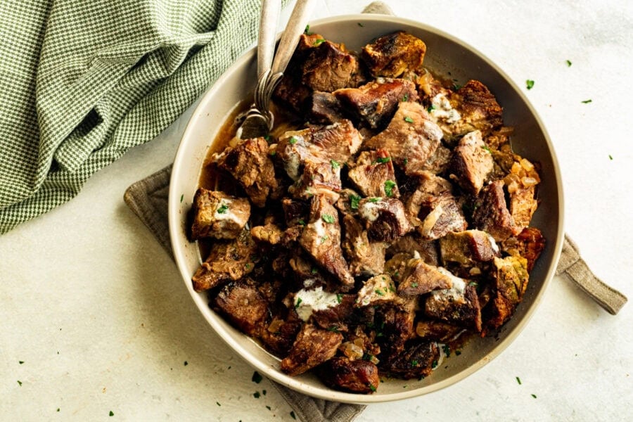 a large serving bowl of tender, fall apart steak bites