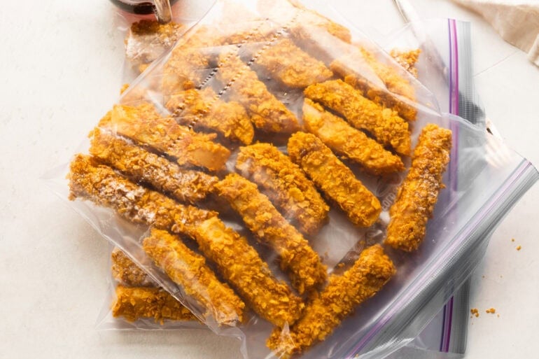 a large ziploc bag full of crunchy french toast sticks ready to be frozen