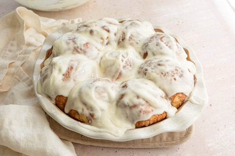 Cinnamon pull apart bread recipe with soft fluffy cinnamon sugar rolls covered in homemade cream cheese frosting