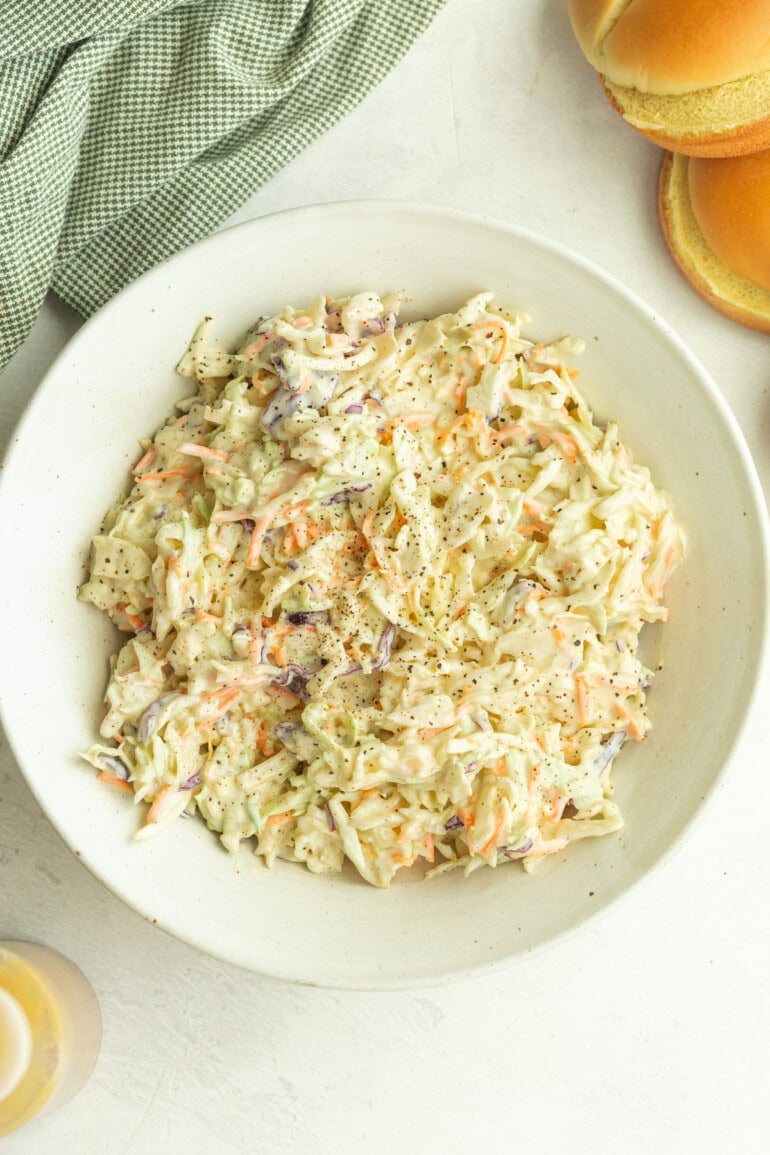 Freshly tossed creamy coleslaw featuring shredded cabbage and just the right touch of sweetness