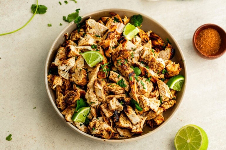 An overhead photo of tender juicy taco night meat fresh off the grill resting on a plate