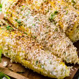 Elote or Mexican street corn is grilled corn on the cob lathered in creamy, cheesy goodness that is so irresistible, you won't be able to live without it! I need this ASAP!