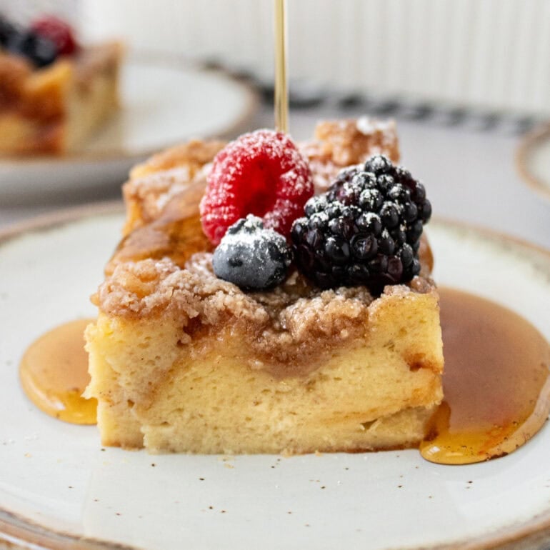 A photo of French toast casserole topped with fresh berries
