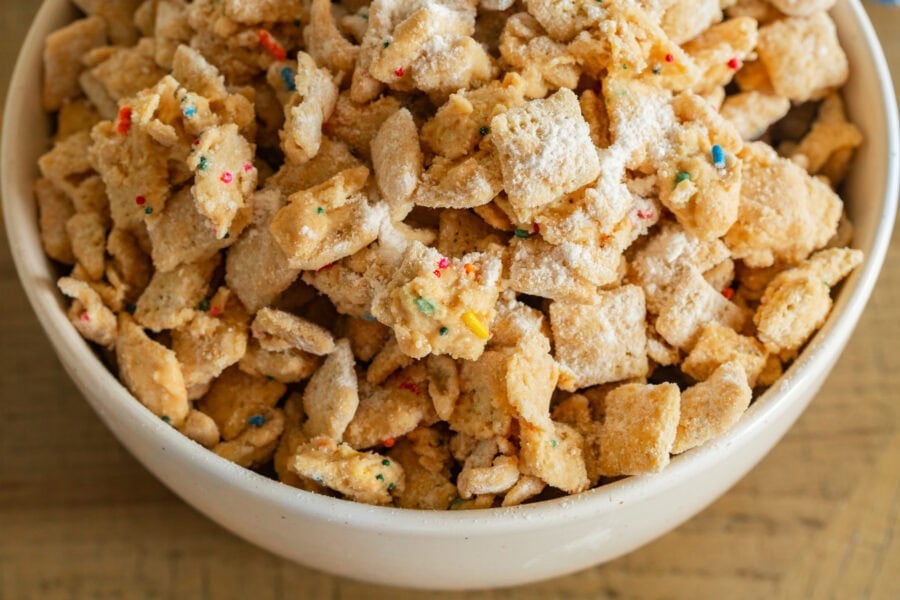 a large bowl of birthday cake muddy buddies