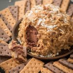 Love German chocolate cake? Especially that sticky coconut frosting? This German Chocolate Cake Cheese Ball is way easier than cake but just as delicious! ohsweetbasil.com
