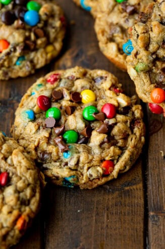 a photo of a thick and chewy monster cookie loaded with mini m&m's, chocolate chips and oats