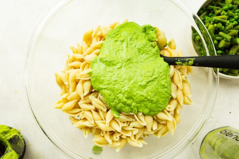 A bowl of noodles and a veggie based dressing