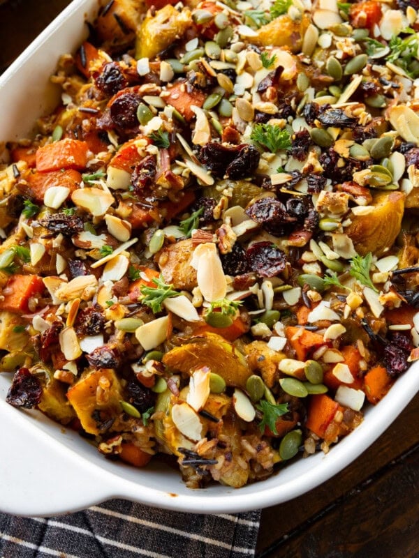 a photo of a white baking dish full of a colorful harvest chicken casserole