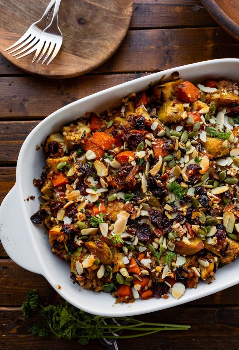 a photo of a baked harvest chicken casserole in a white casserole dish 