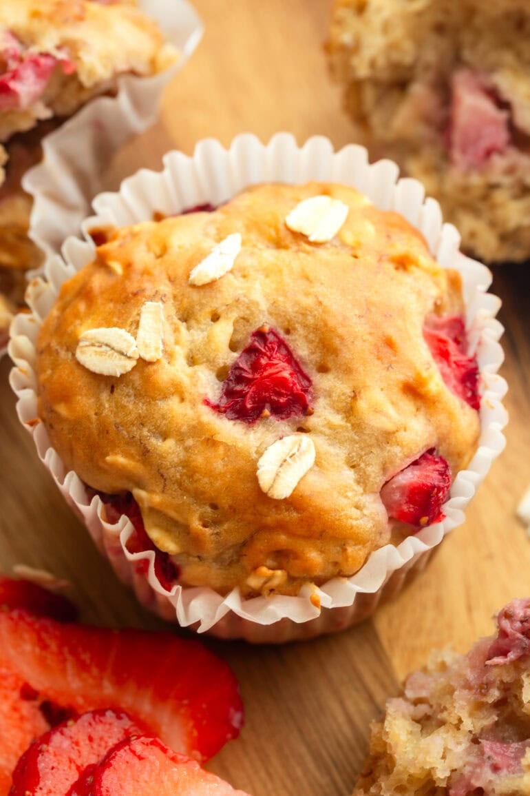 A close up image of an individual muffin from this strawberry oat muffin recipe