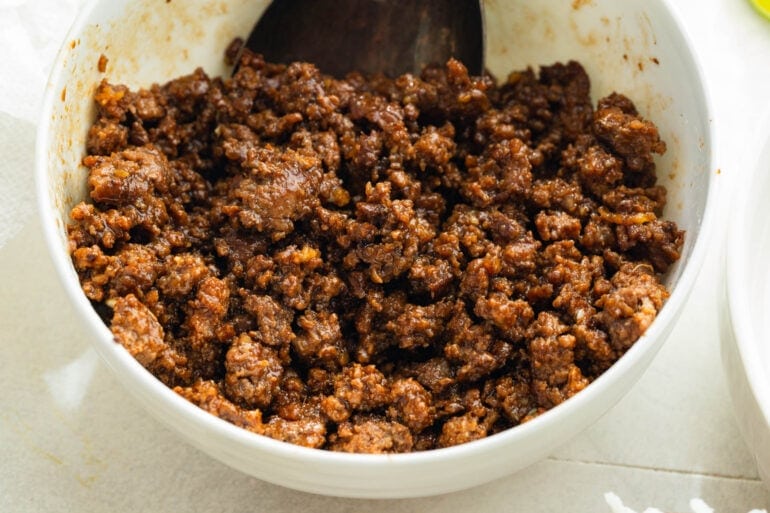 Crispy ground beef caramelizing in a skillet for Korean beef broth bowls